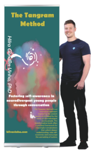 Picture of a yung man standing next to the banner which is similar to the book cover. 
Book title: The Tangram Method.
Tile appears in yellow over a teal background. Banner also shows author's name (Hilra Gondim Vinha, PhD) and the book subtitle, which is Fostering self-awareness in neurdivergent young people through conversation.
At the lower part of the banner it reads: The Tangram Method is an innovative approach inspired by the ancient puzzle and shaped by the voices of neurodivergent young people. This transformative bookoffers a practical framework for meaningful conversations that unlock deeper understanding, raise self-awareness and encourage the unmasking of autism. 
Below that description there is a link to the author website, this one here (hilravinha.com).
